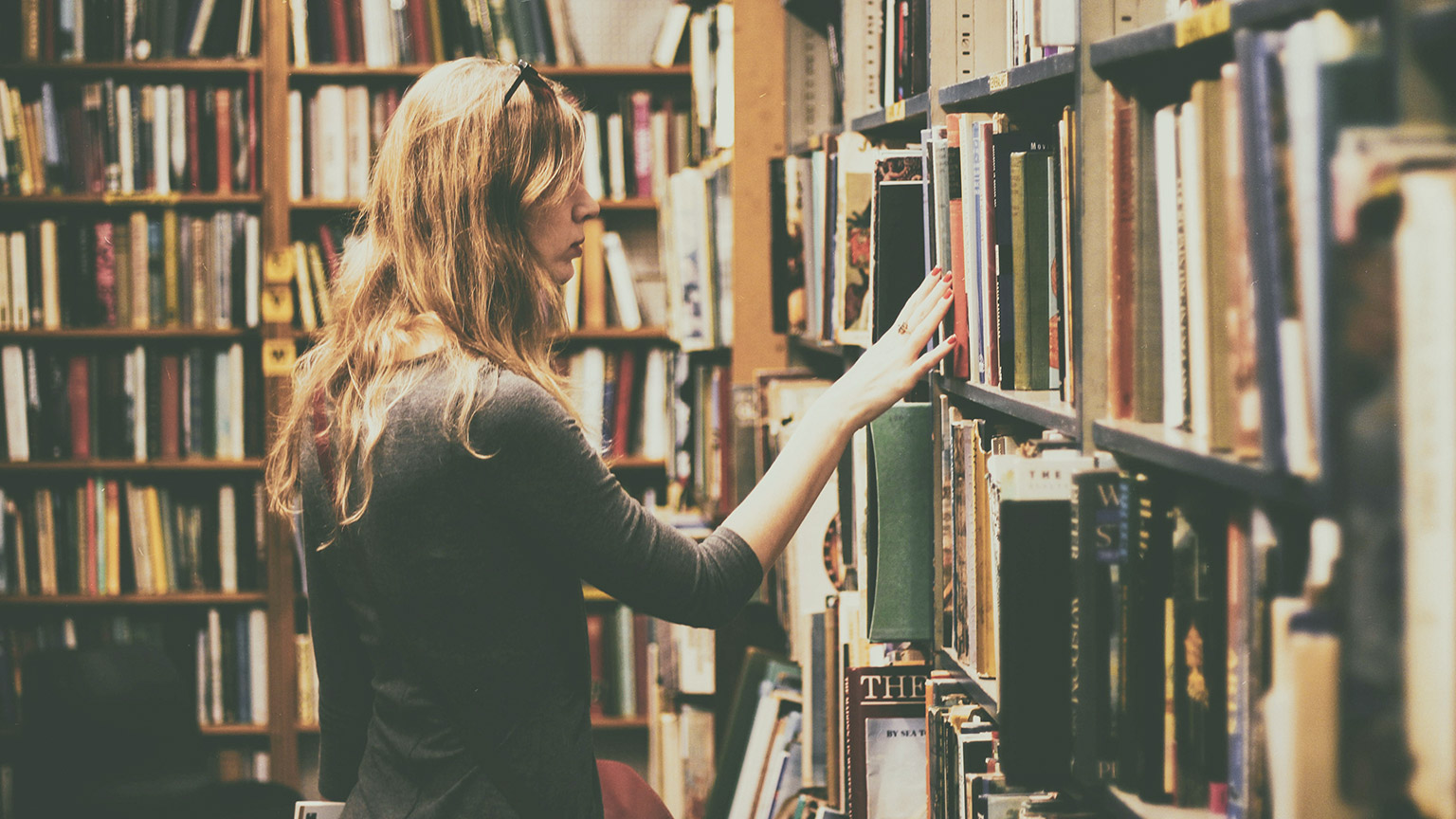 A student browsing through reference materials