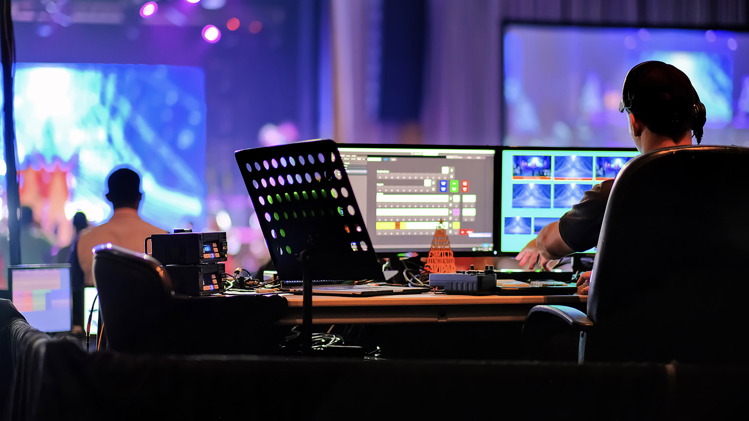 Technical staff operating broadcasting equipment