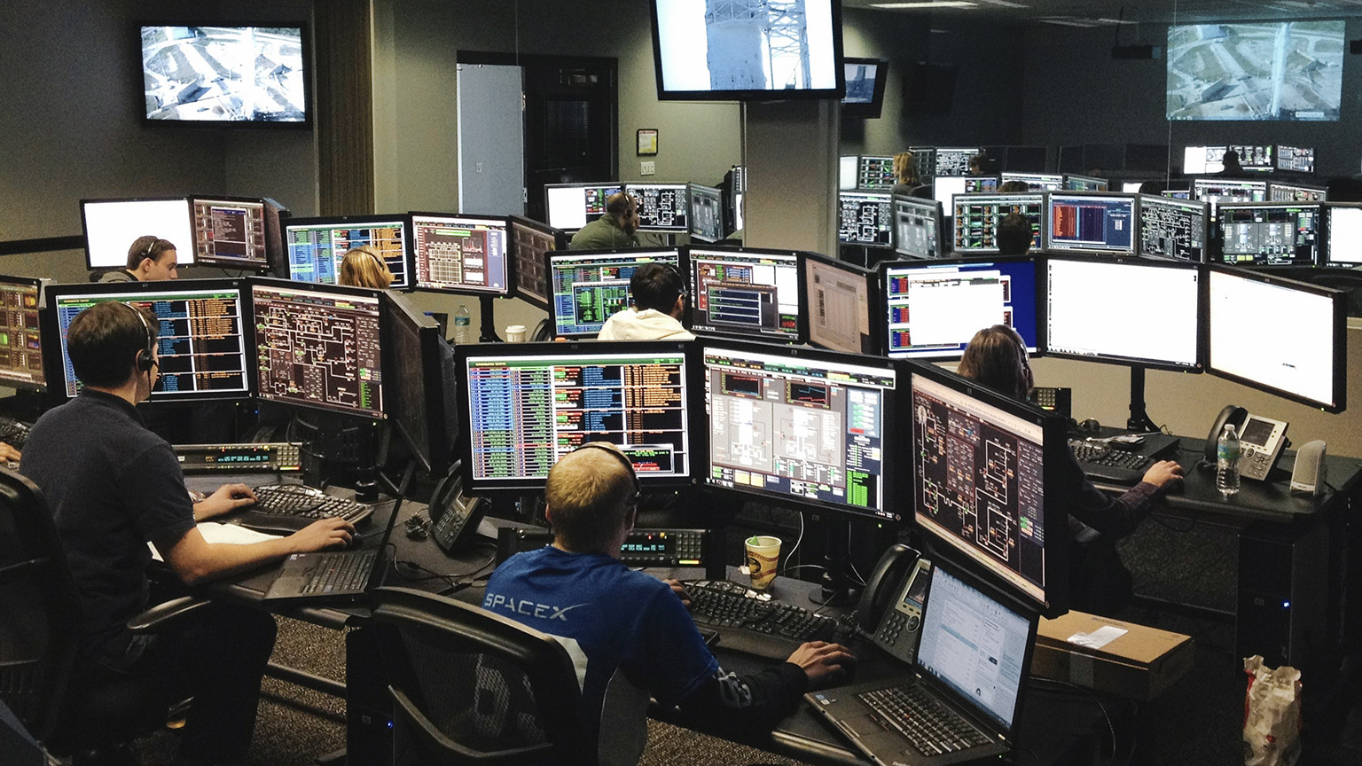 main topic image of tech workers at computer screens