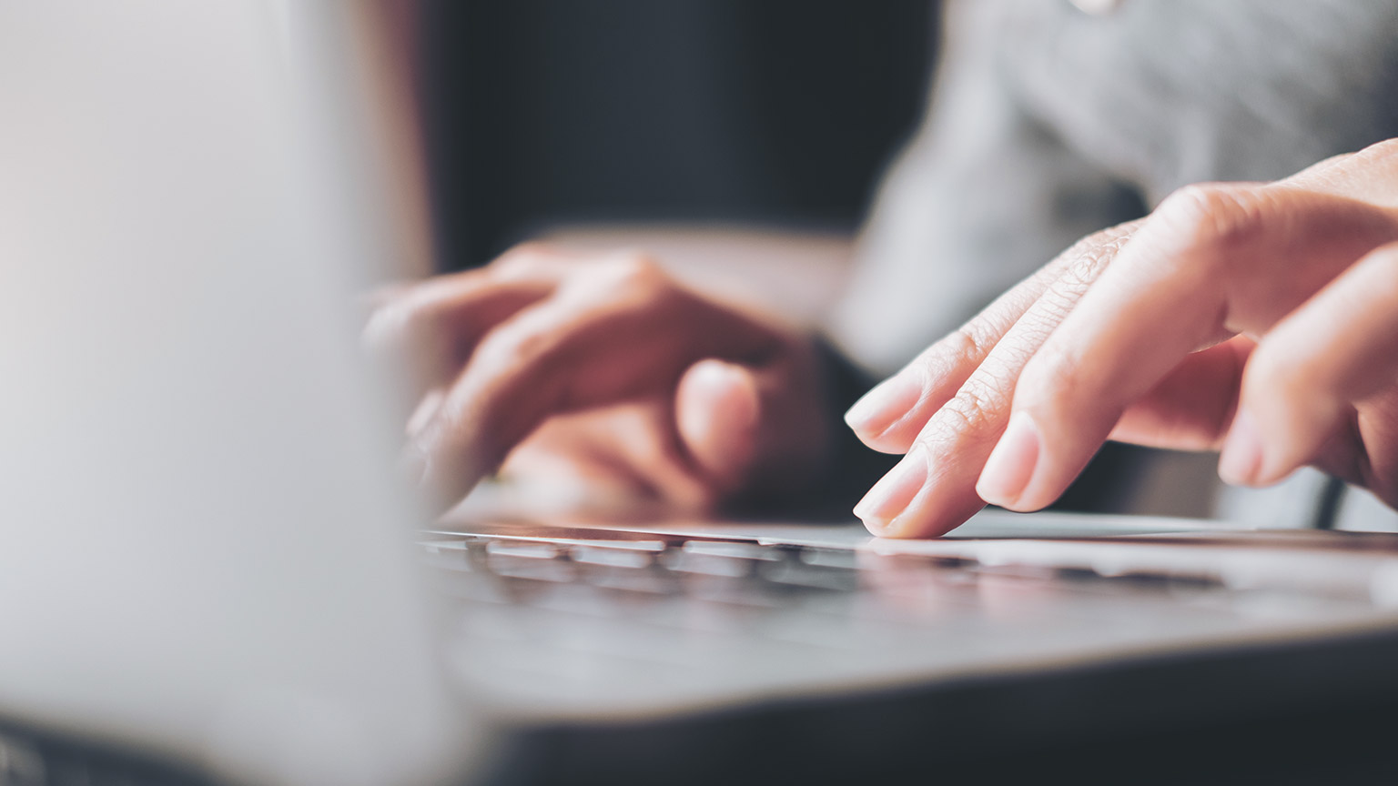 A close view of a person typing on a keyboard