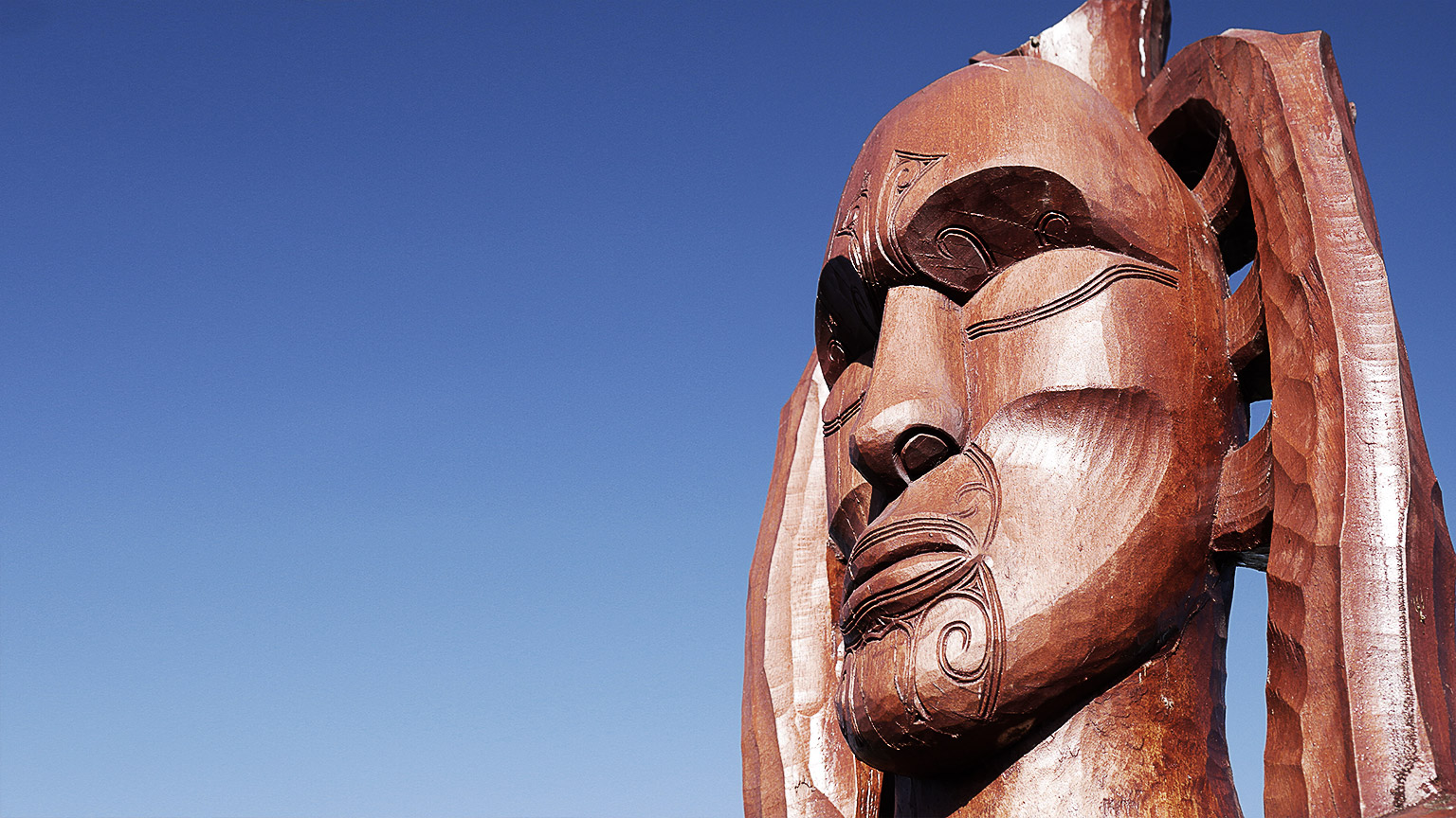 Traditional Maori carving of Hine Raumati showing just the head