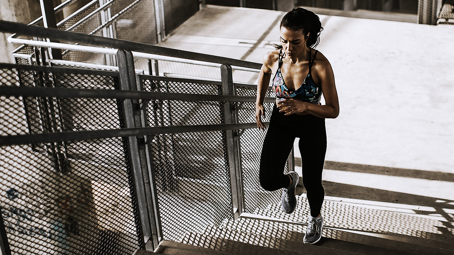 Woman running up stairs