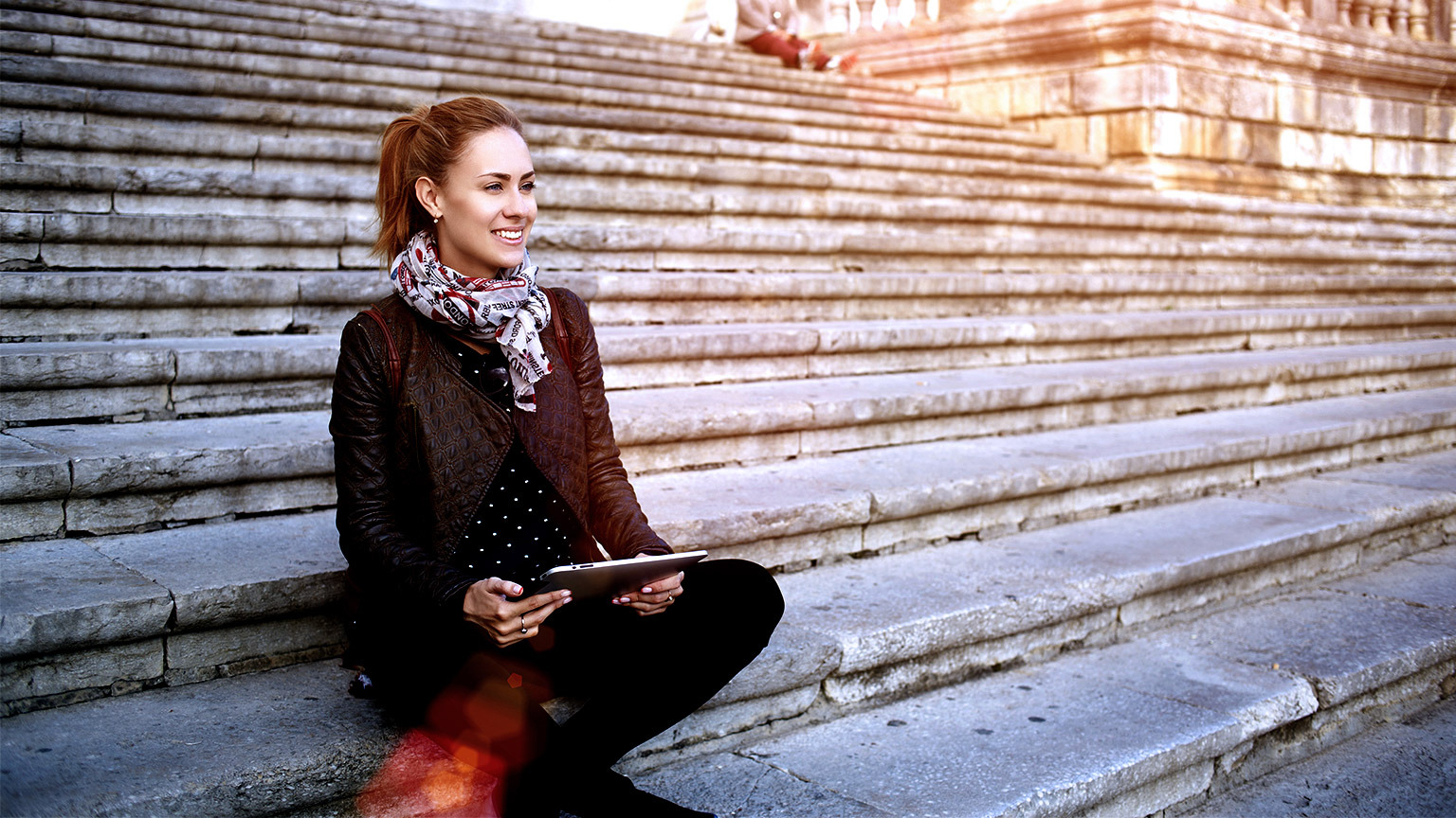 Woman sitting on campus stairs outdoor