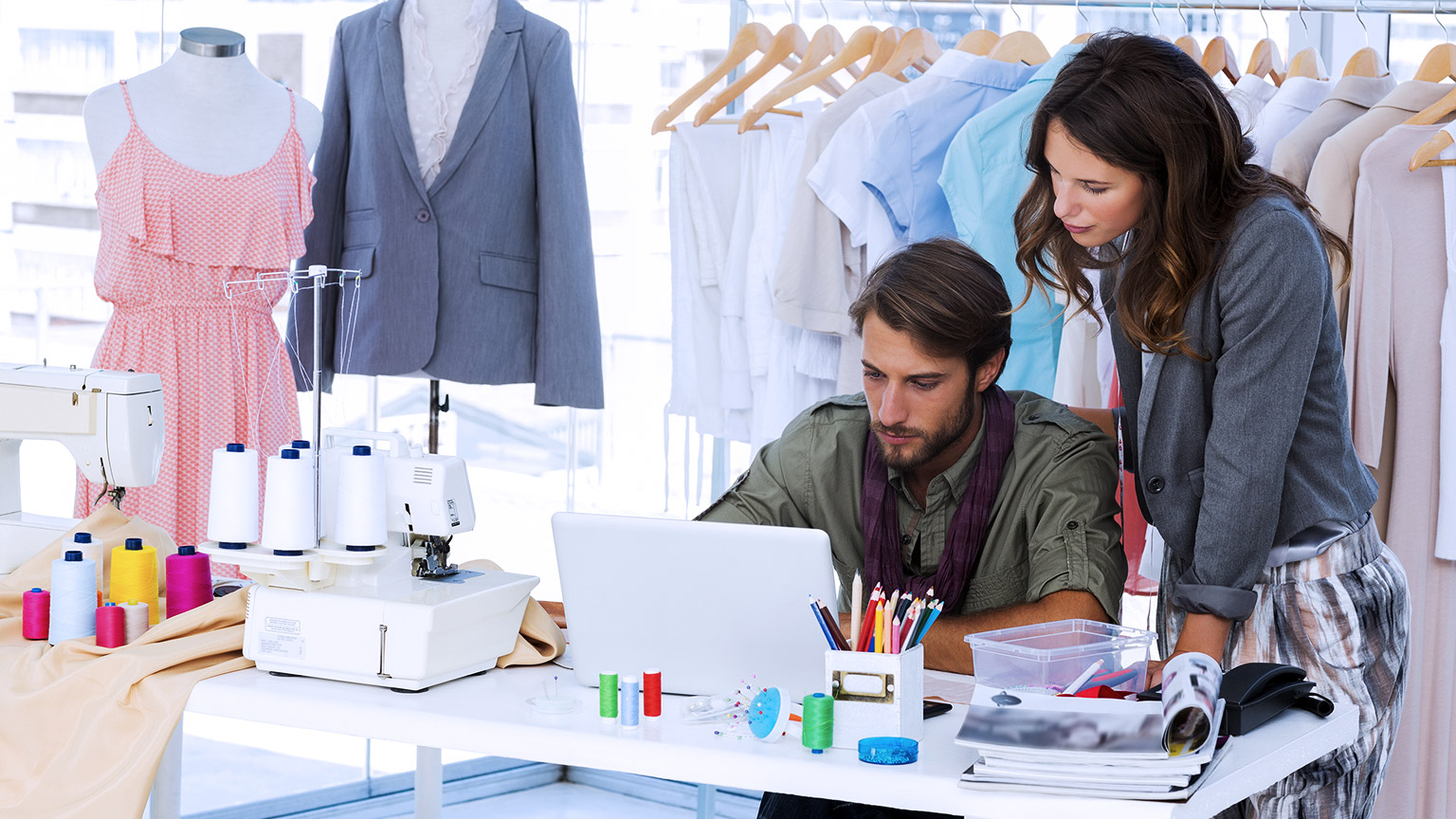 Fashion designers working with laptop