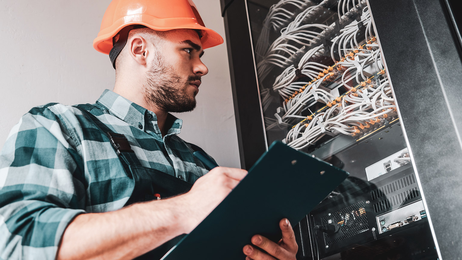 An electrician checking a site for safety concerns