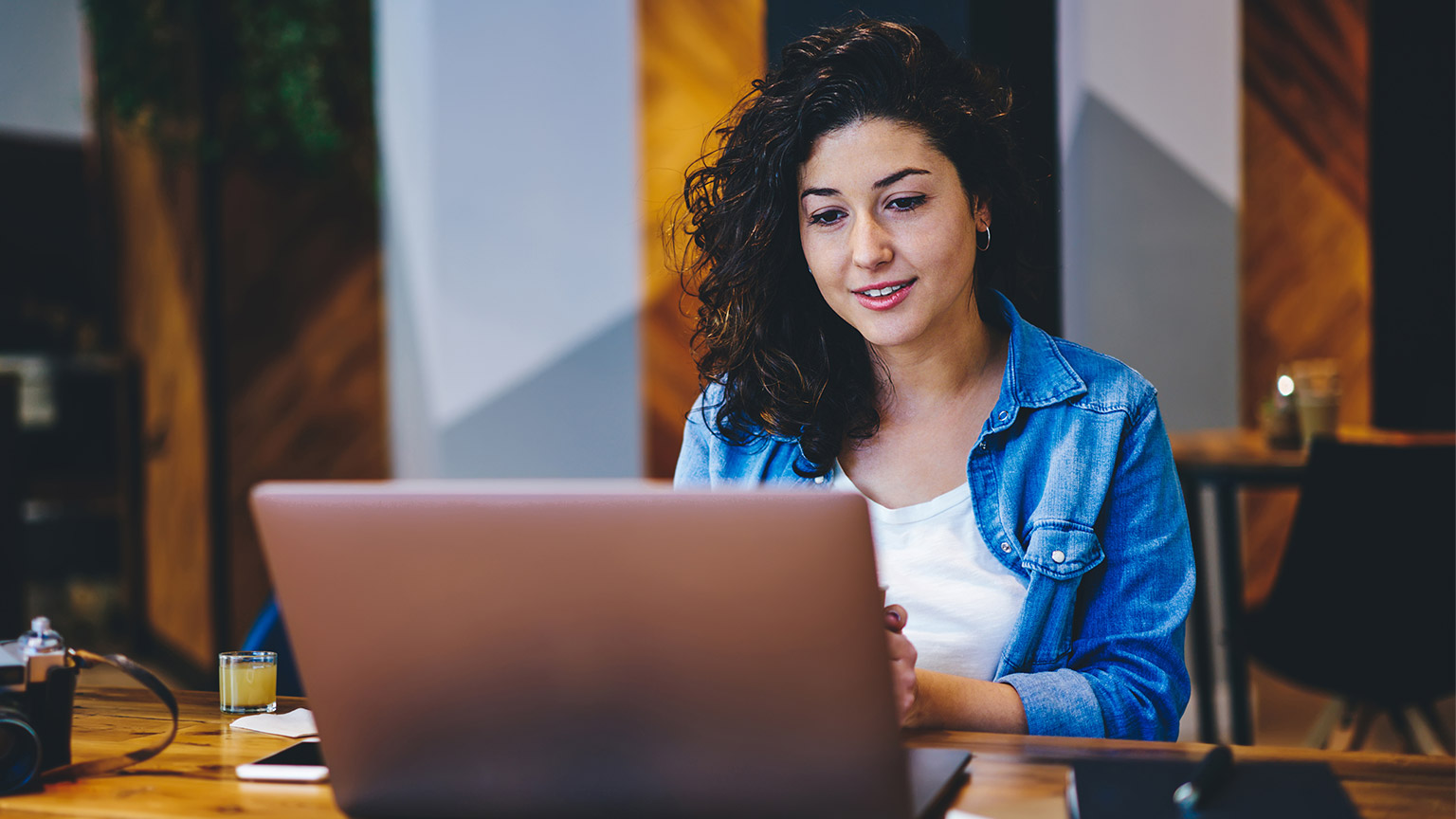 A student doing an online course on a laptop