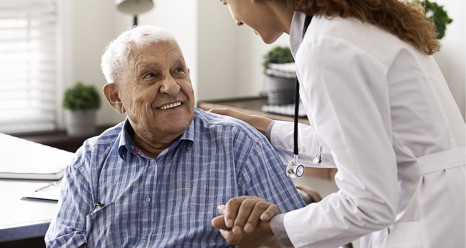 An elderly talking to a doctor