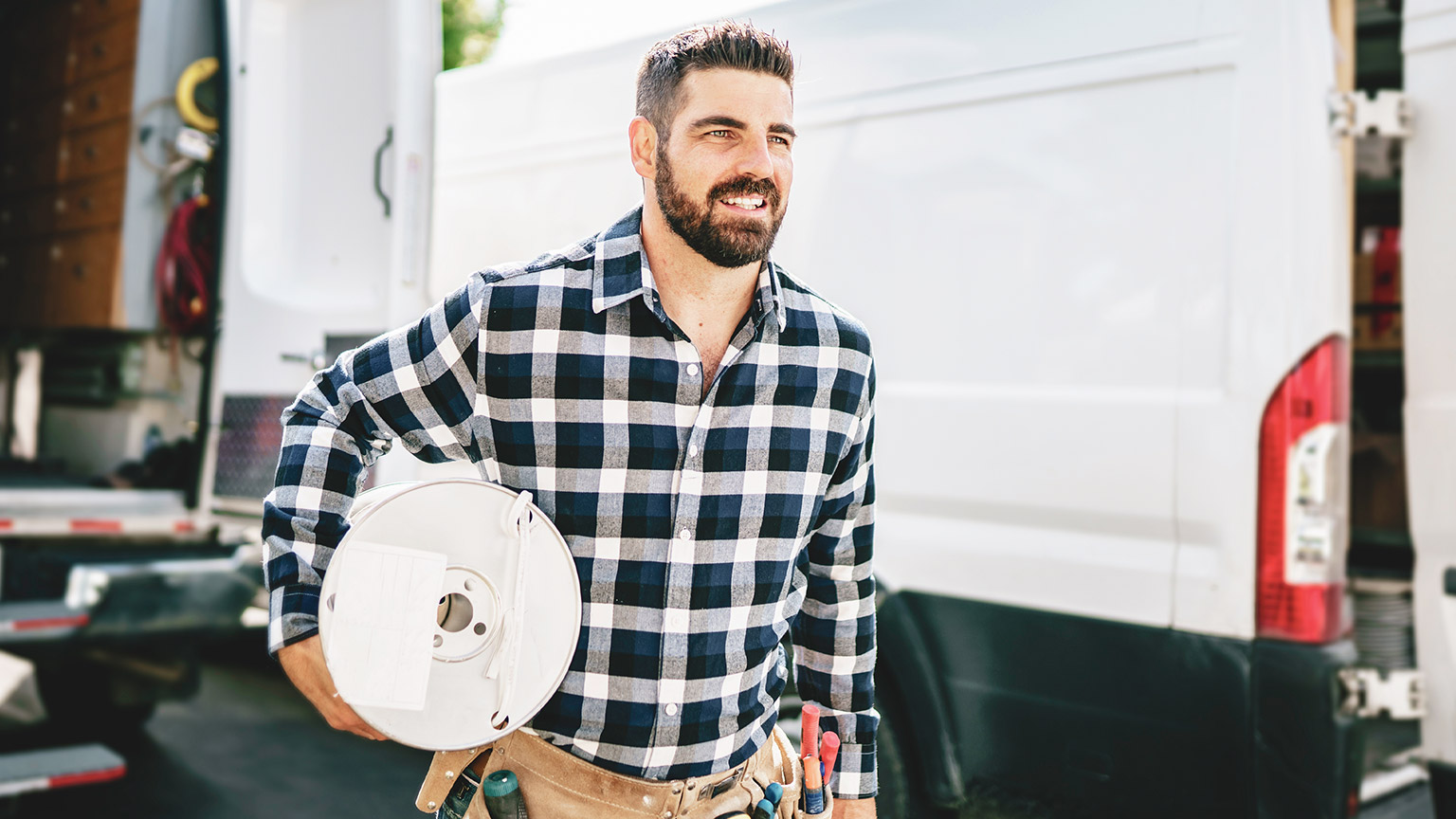 A happy electrician on a worksite