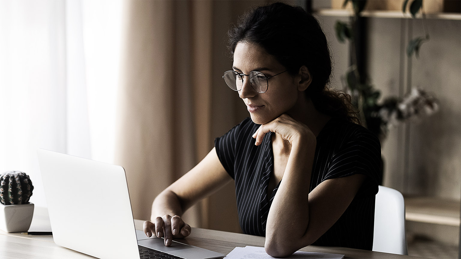 A person researching in a laptop