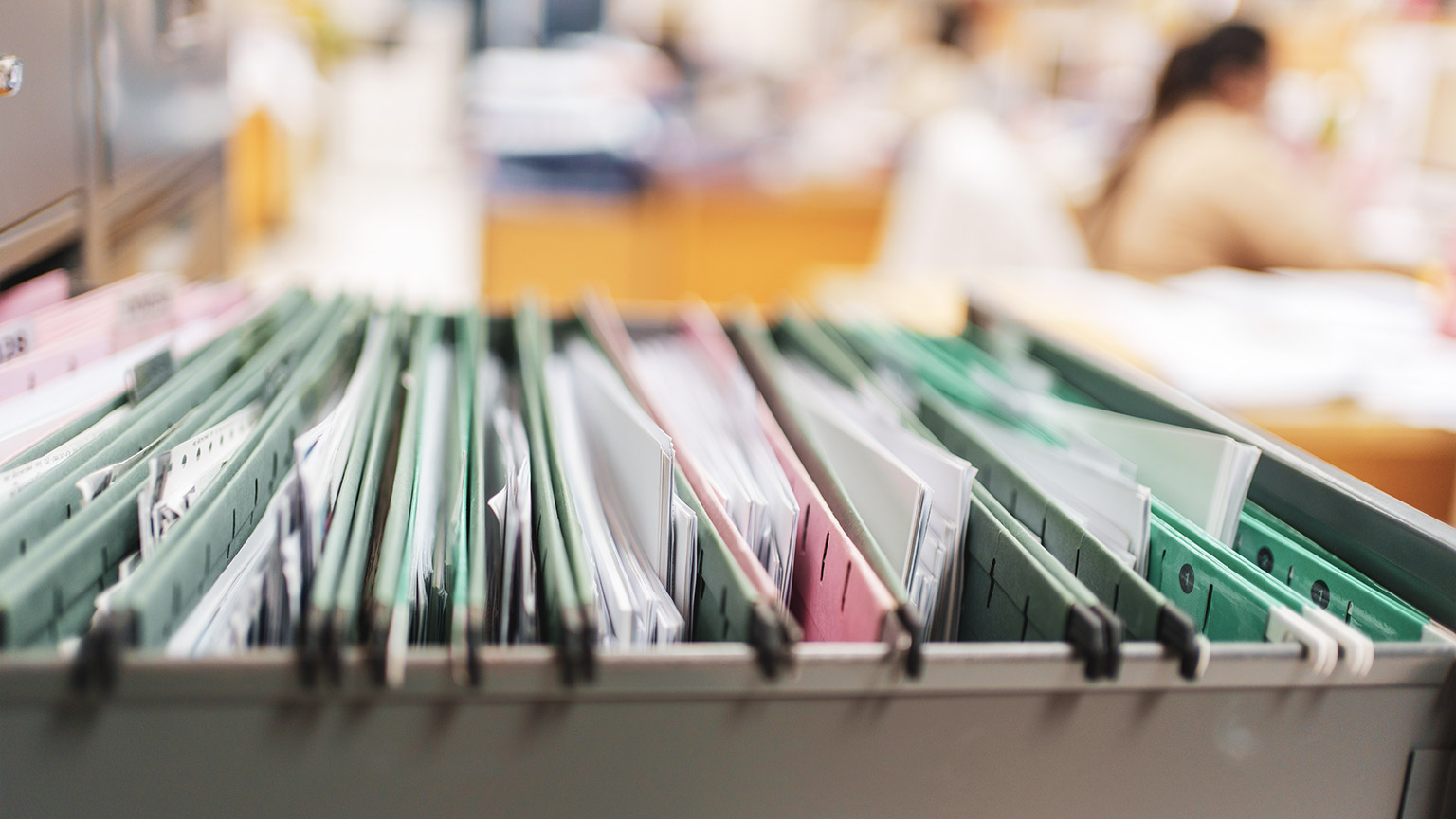 A close view of an open filing cabinet drawer