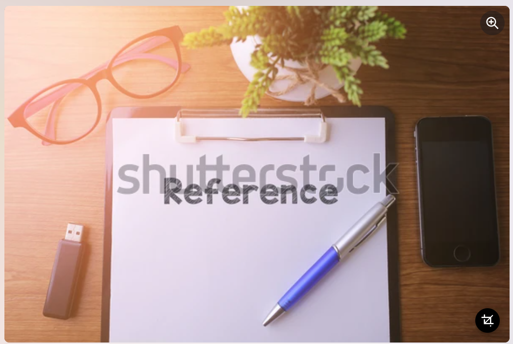 Office desk with a paper written Reference with pen, glass, smartphone and a thumb drive