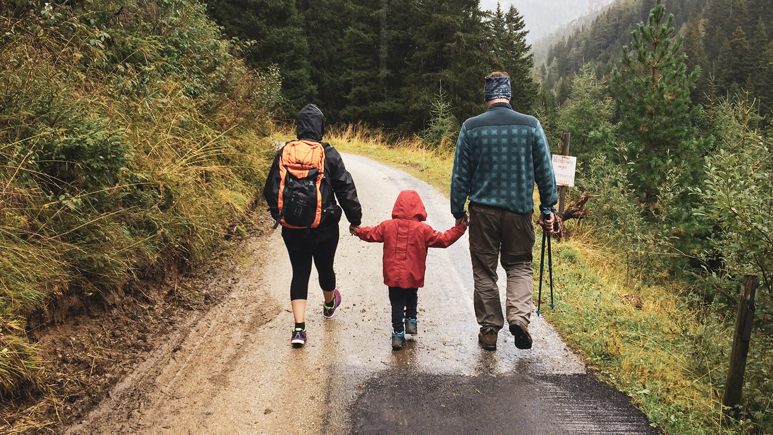 A family walking along a track in the outdoors