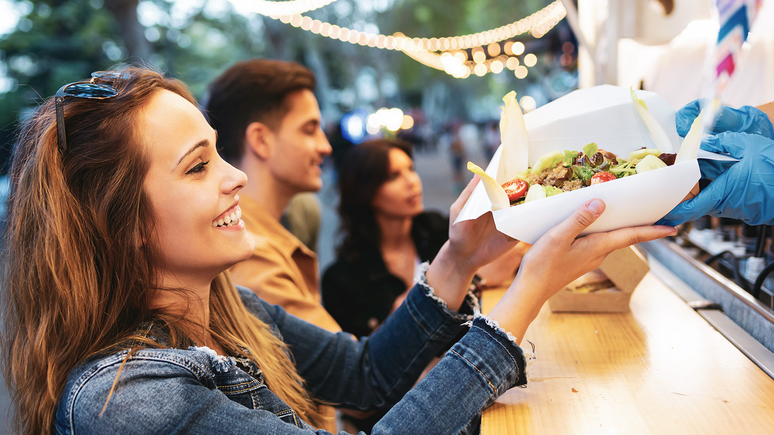 A person buying healthy take away food