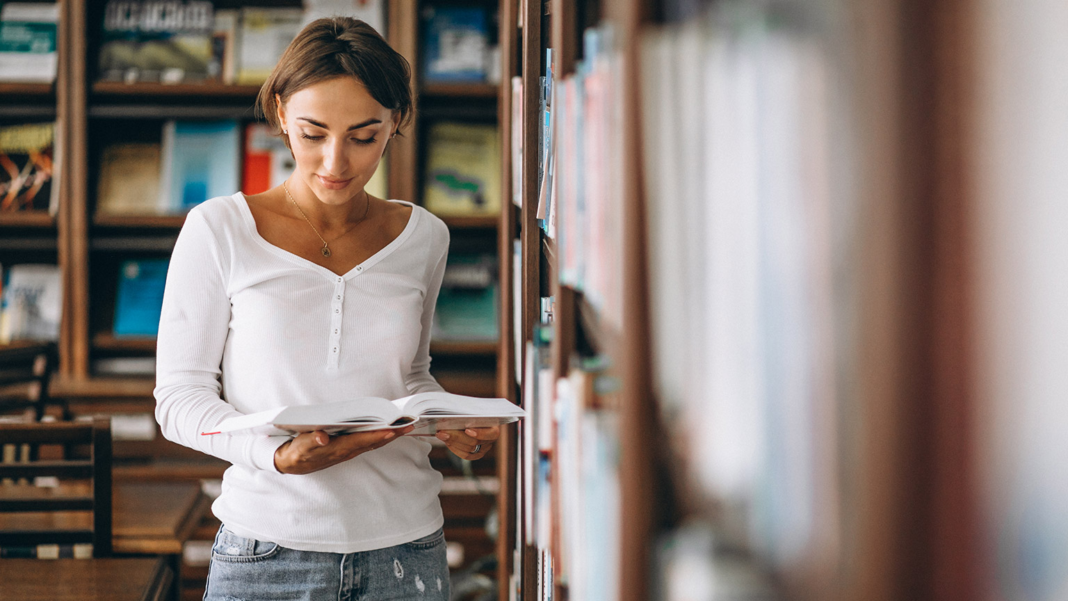 A person reading in a library