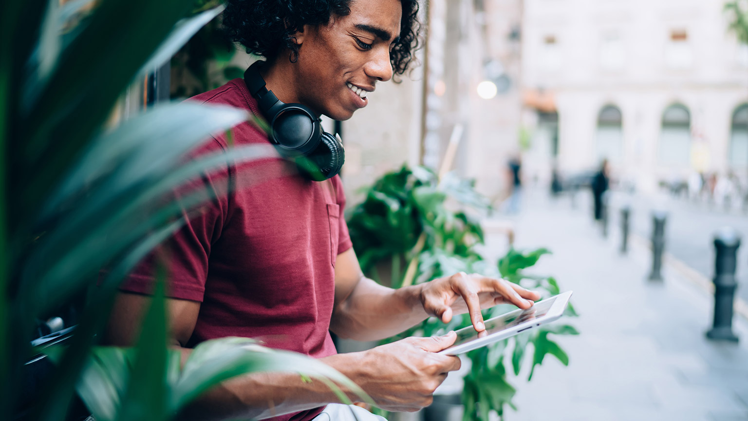 A student reading reference materials on a tablet device