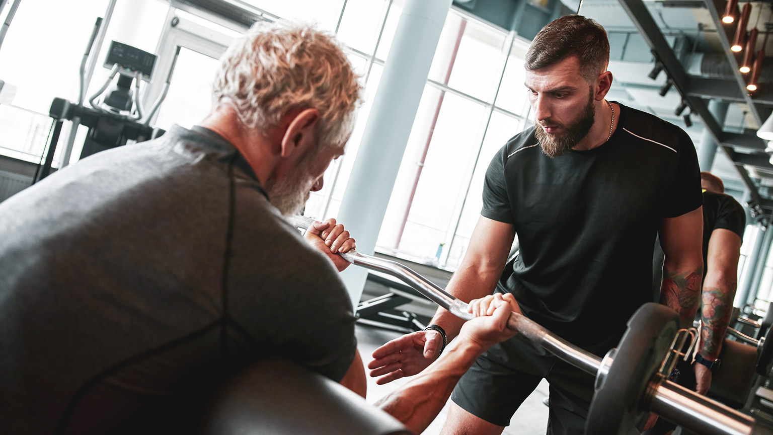 A trainer motivating a client during a workout