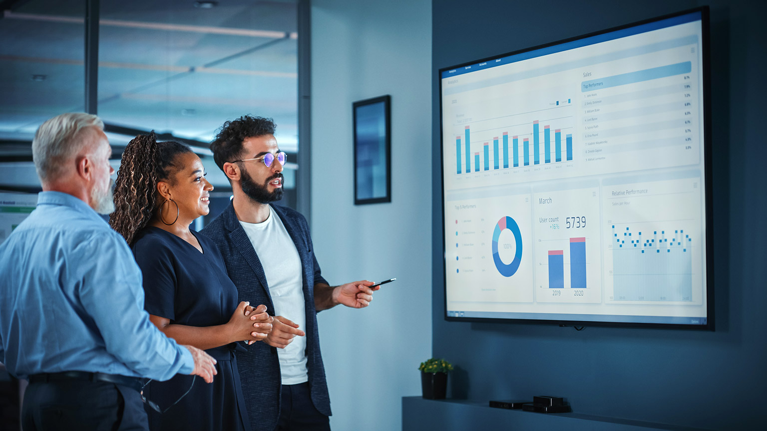 A business person presenting information to colleagues