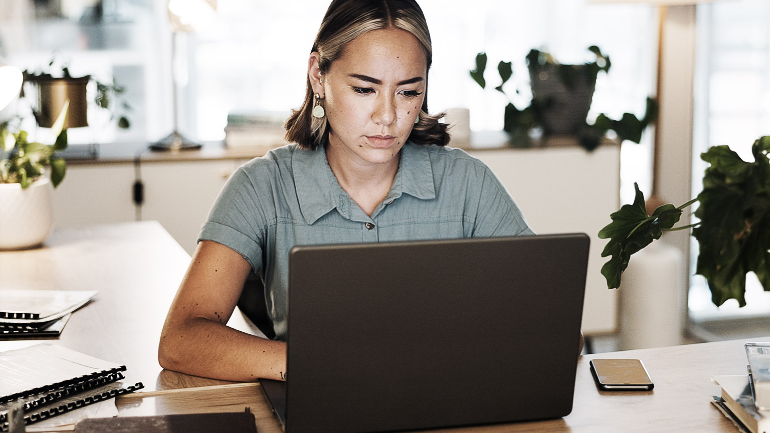 A person thinking while using the laptop