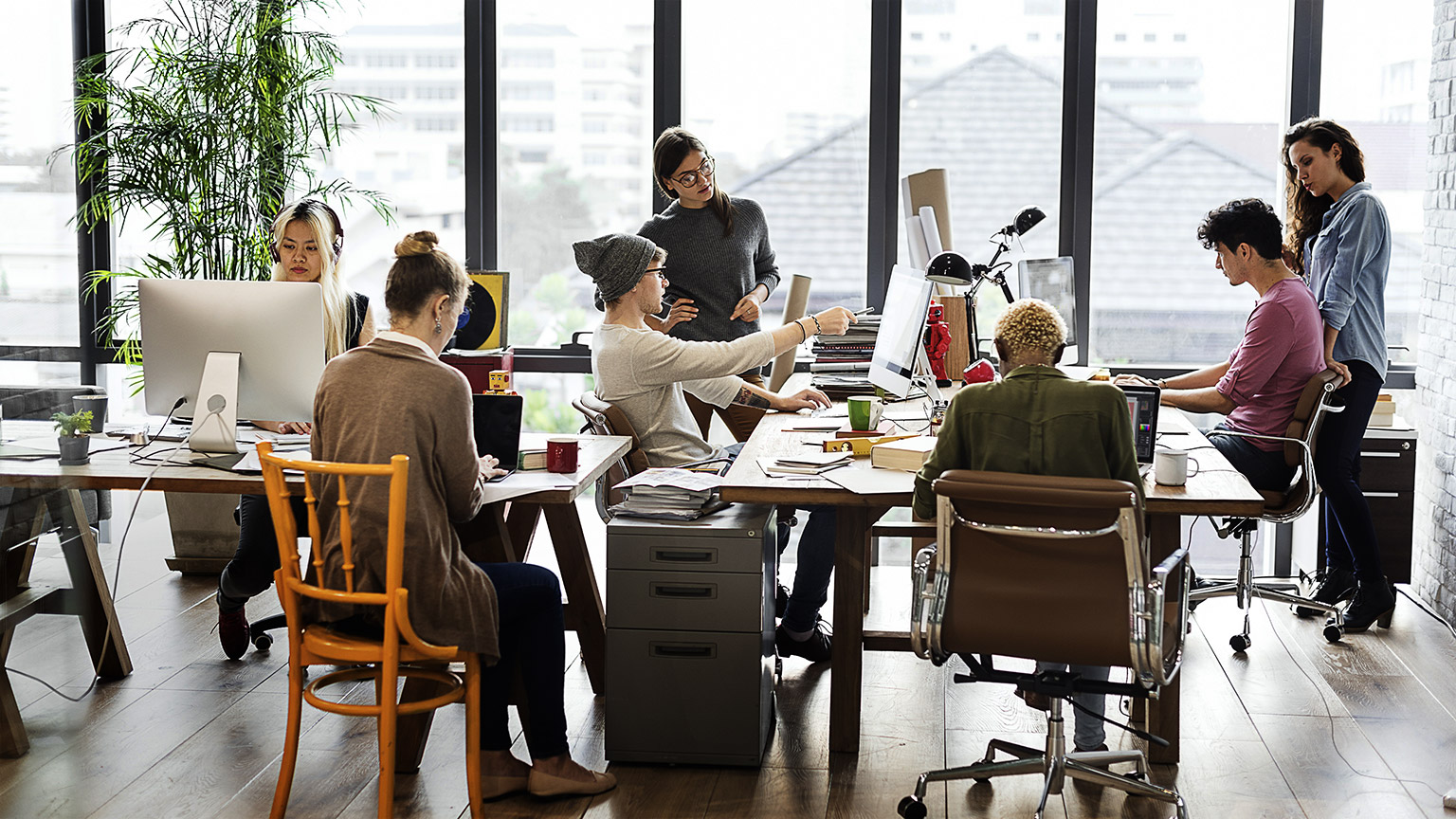 Group of people in casual work attire working