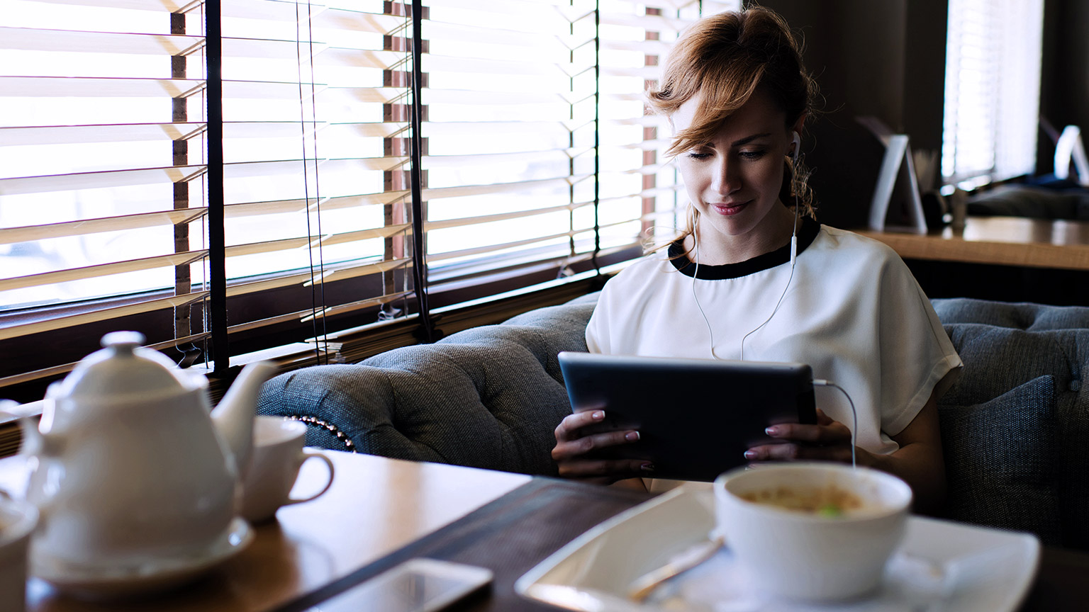 Woman listening on online learning tool