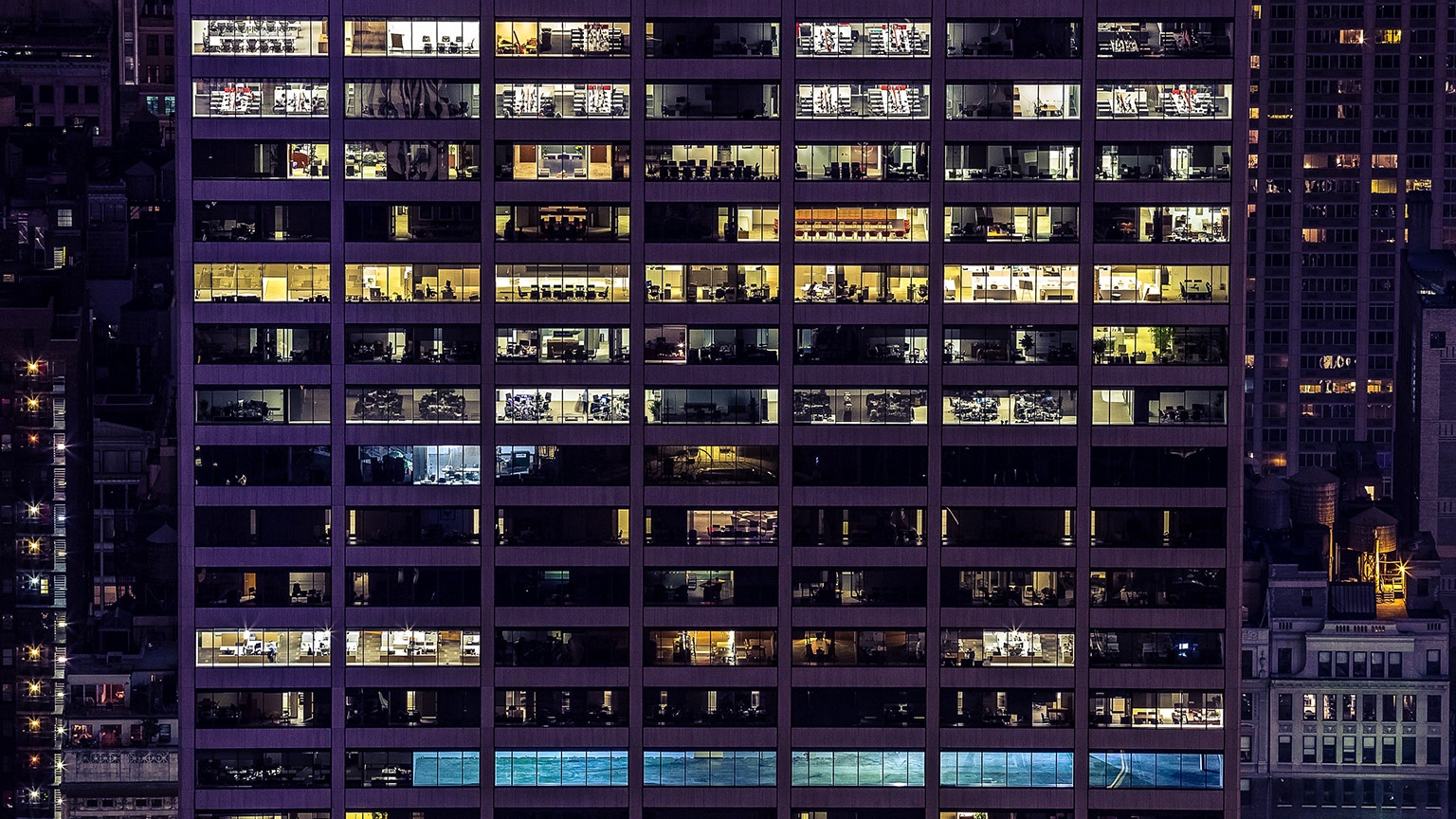 A night view of a busy office building