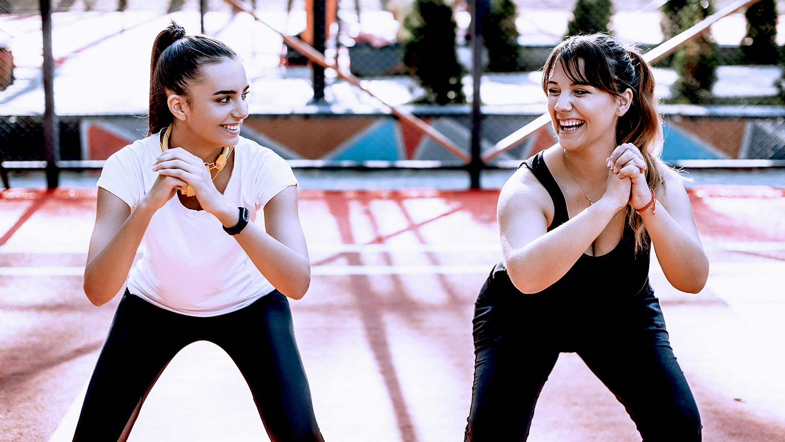 Two woman doing exercise in the park