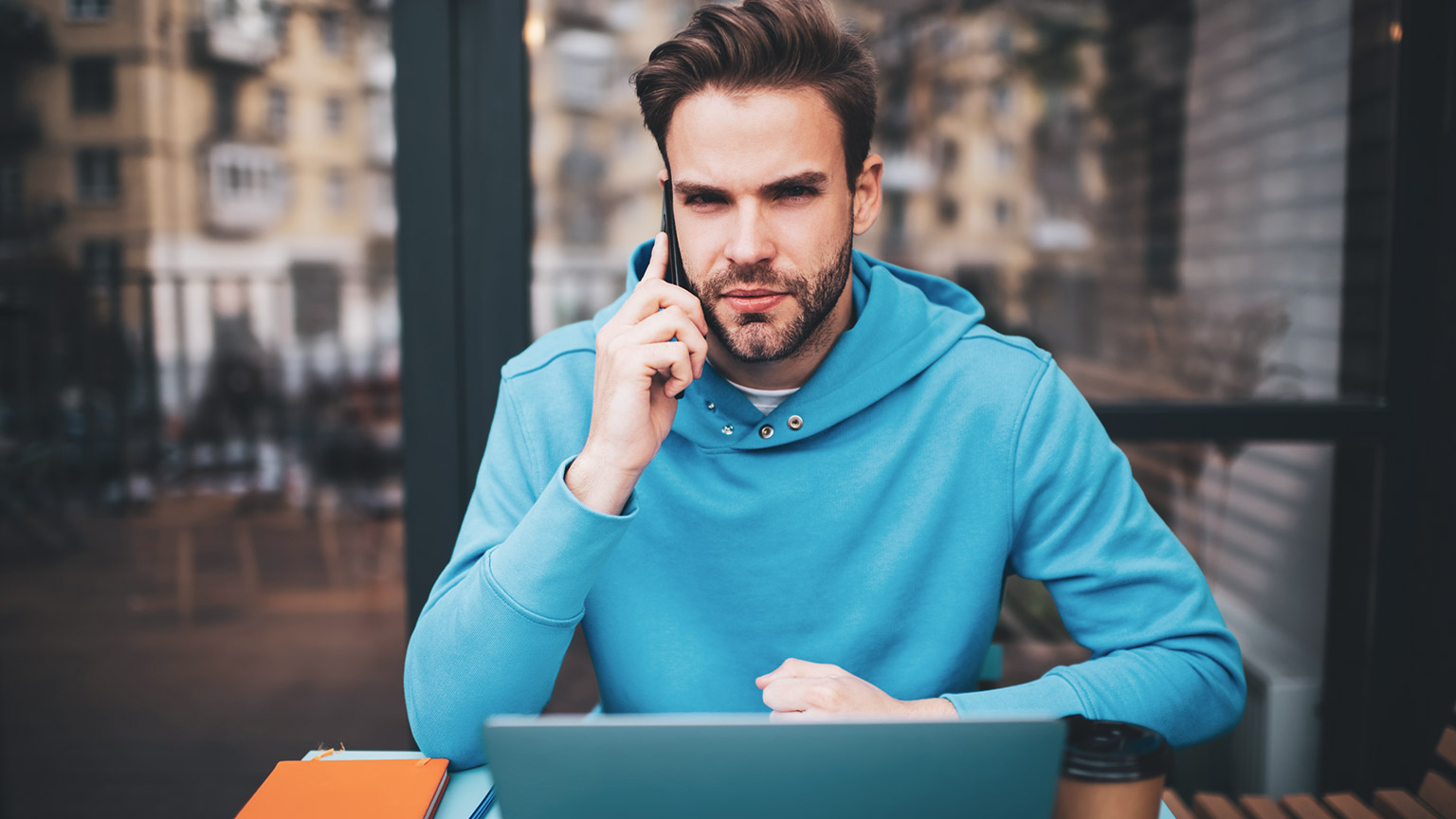 A headhunter talking on the phone to a potential client