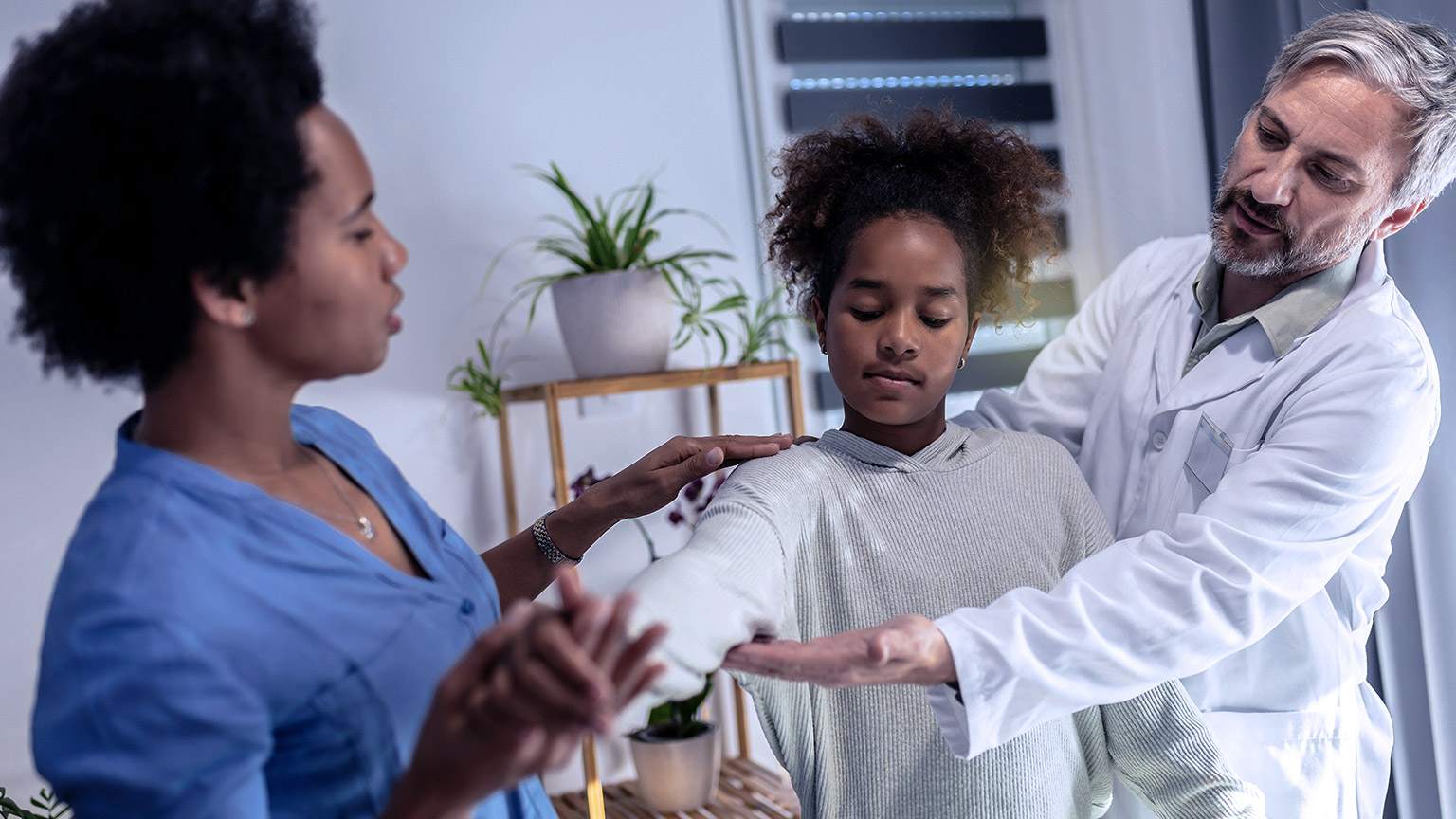 Child receiving help from physical therapists