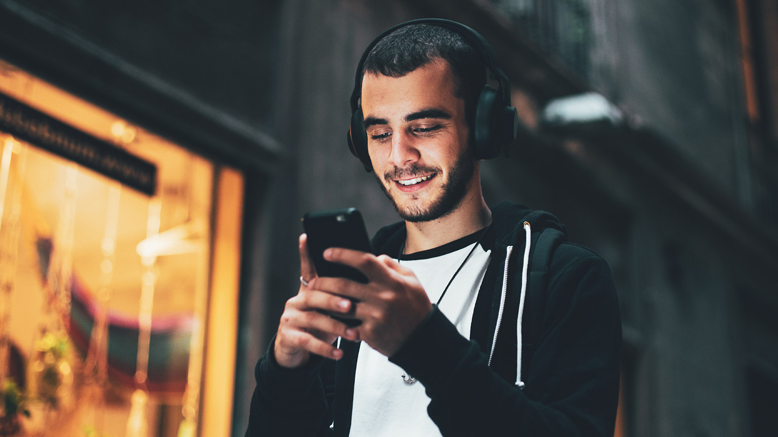 A gamer enjoying social media on his phone