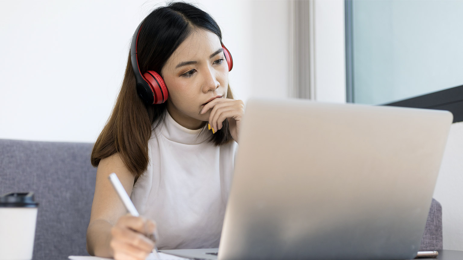 Woman with laptop and headphone