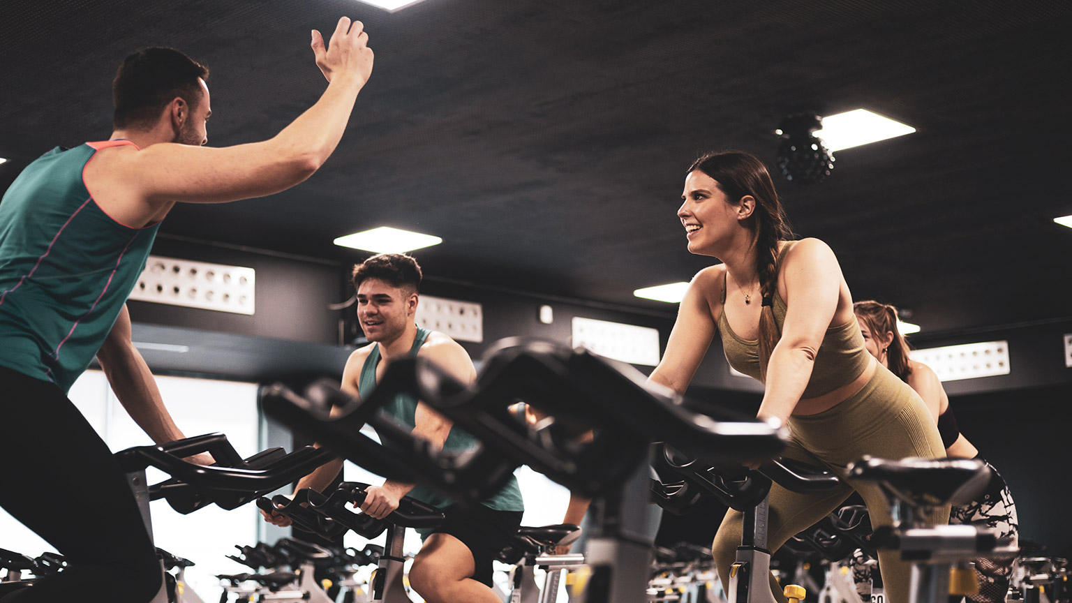 A fitness instructor leading a spin class