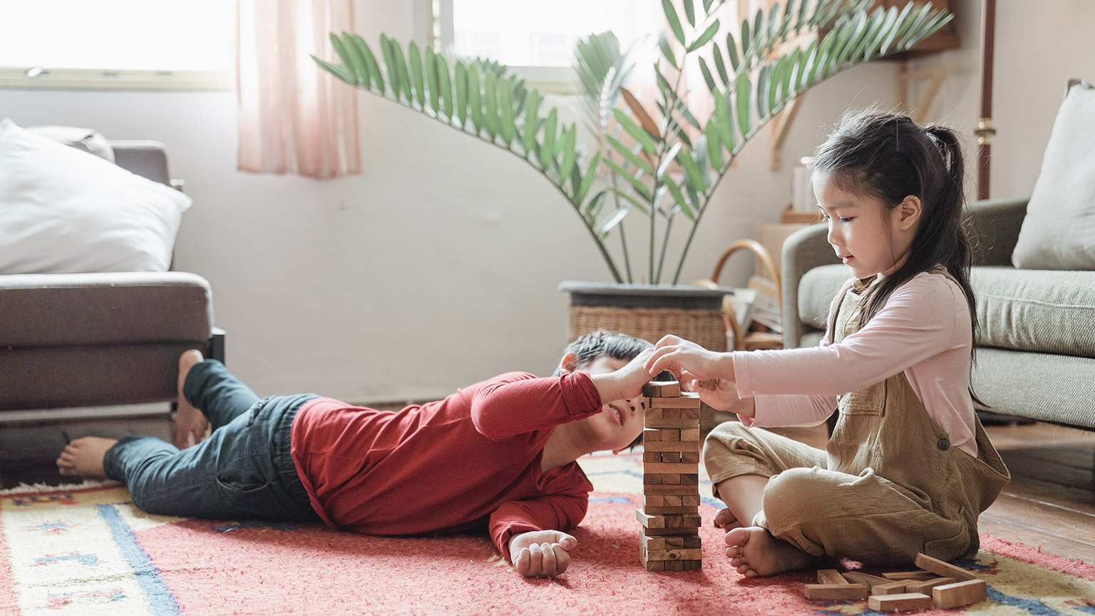 Children playing wooden toy