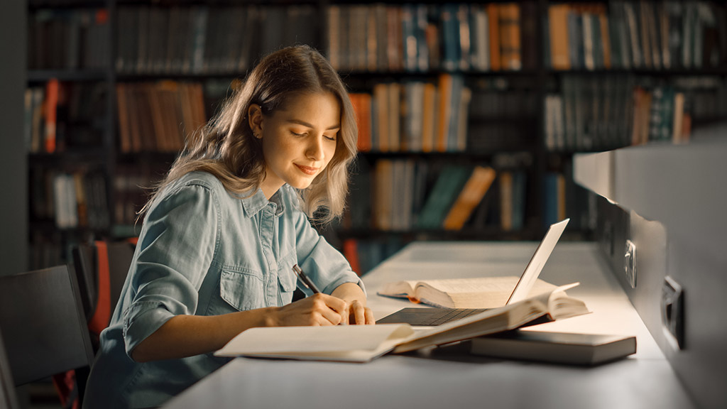 Girl uses Laptop, Writes Notes for Paper, Essay, Study for Class Assignment