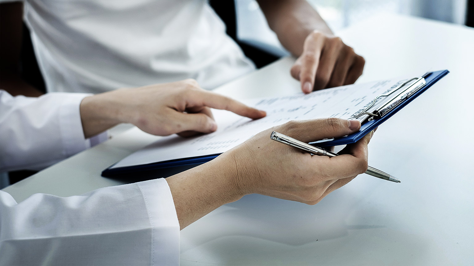 A medical professional reminding employees of safety guicdelines