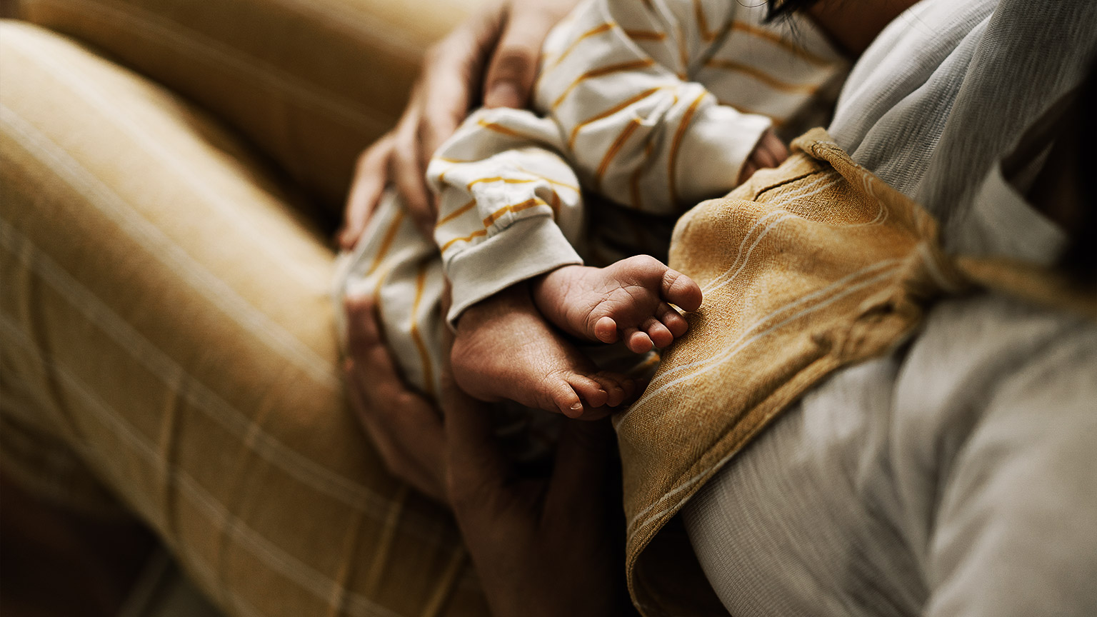 A child being held by mother