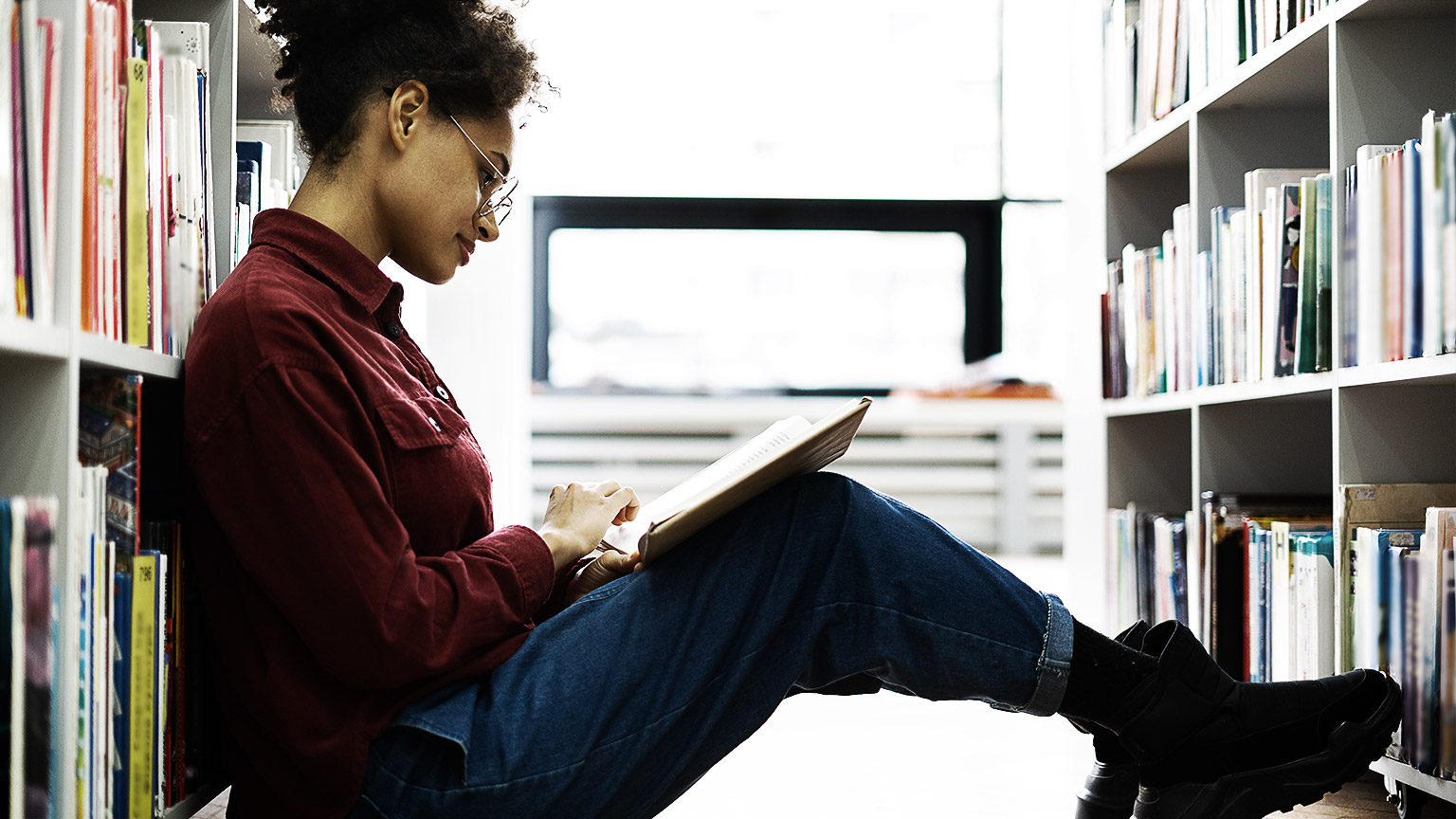 A student reading in a library