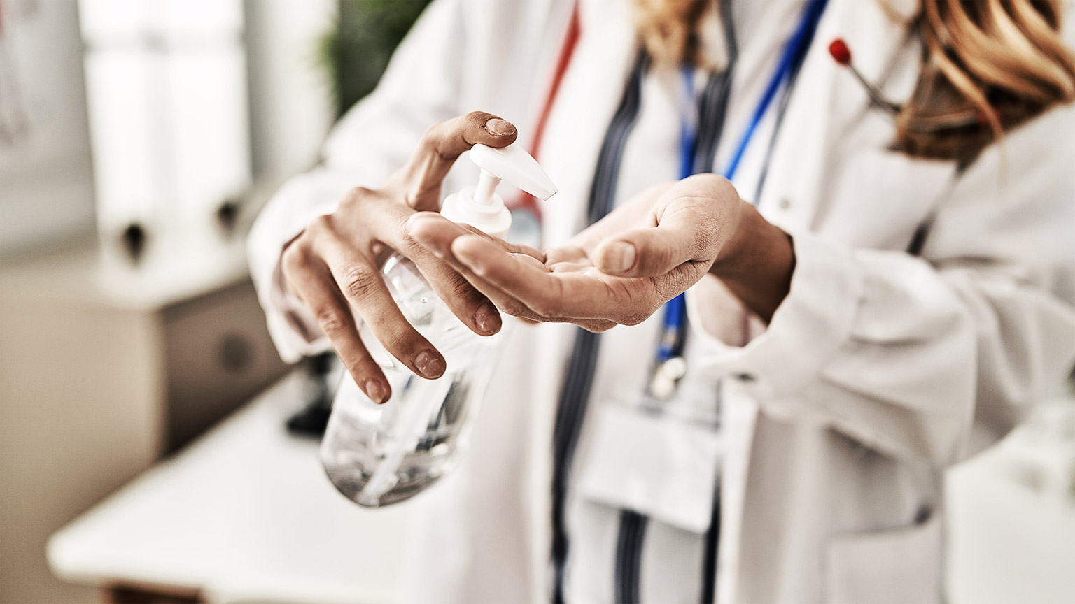 A person putting disinfecting hands