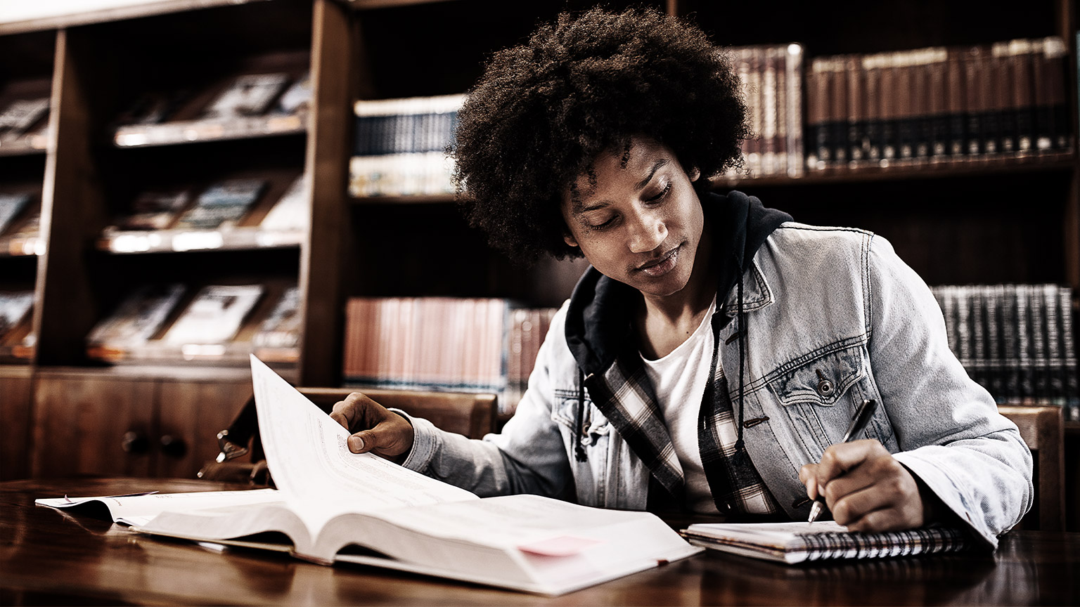 A student reading in a library