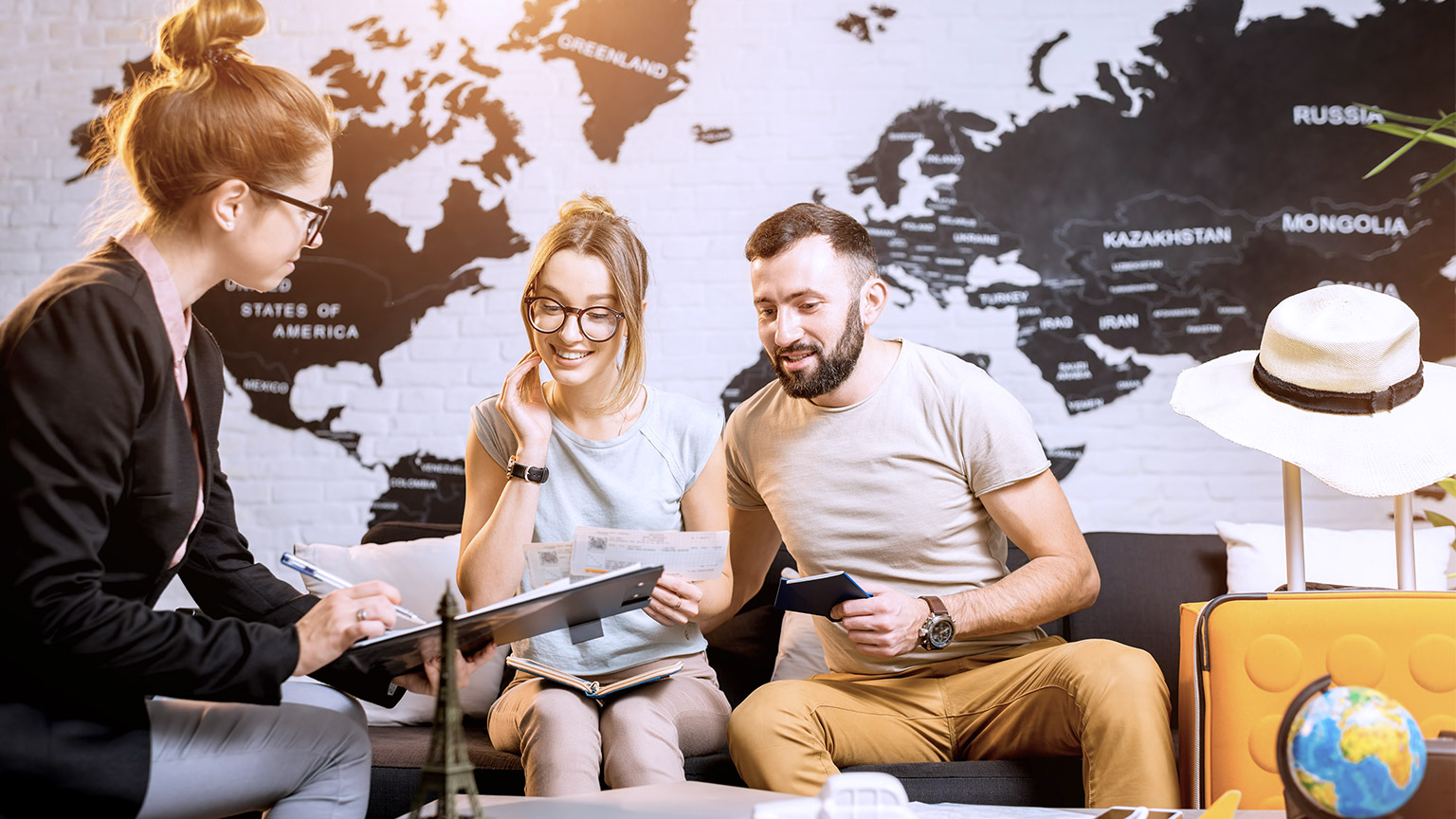 Young couples consulting a travel agent