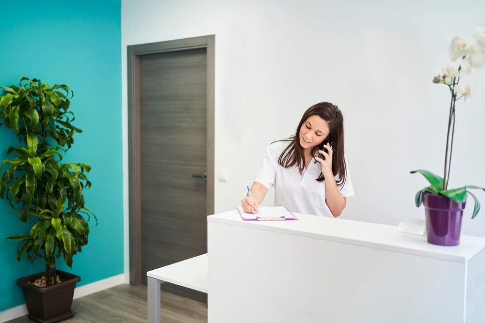 Woman at reception of a medical practice