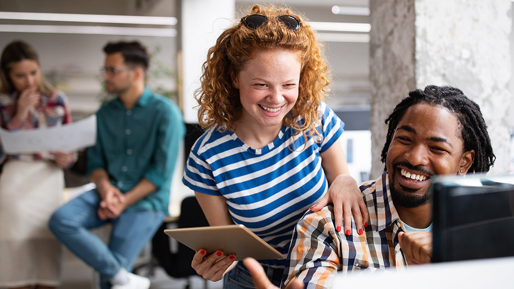 Group of business people and software developers working as a team in office