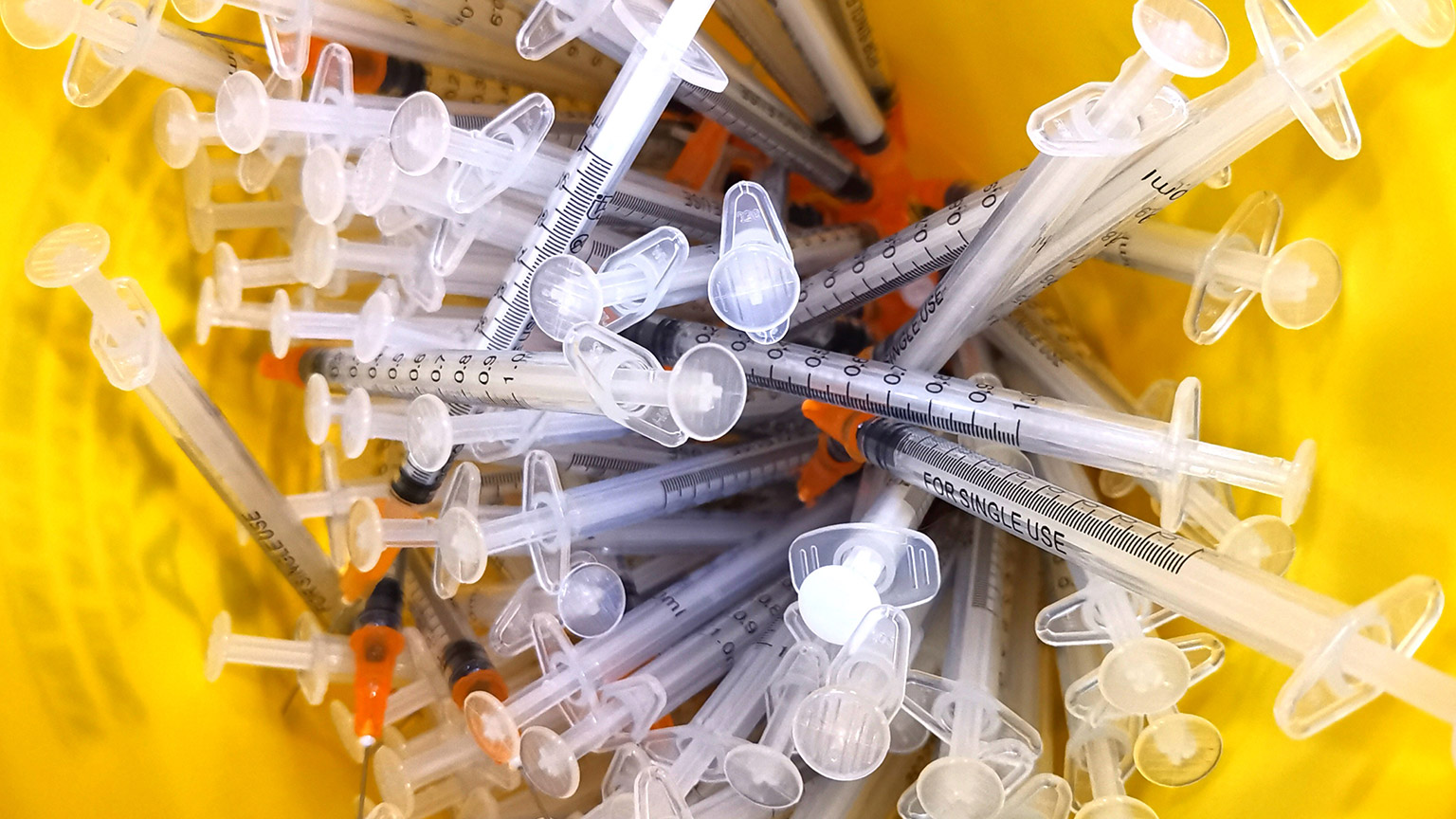 A container full of used needles