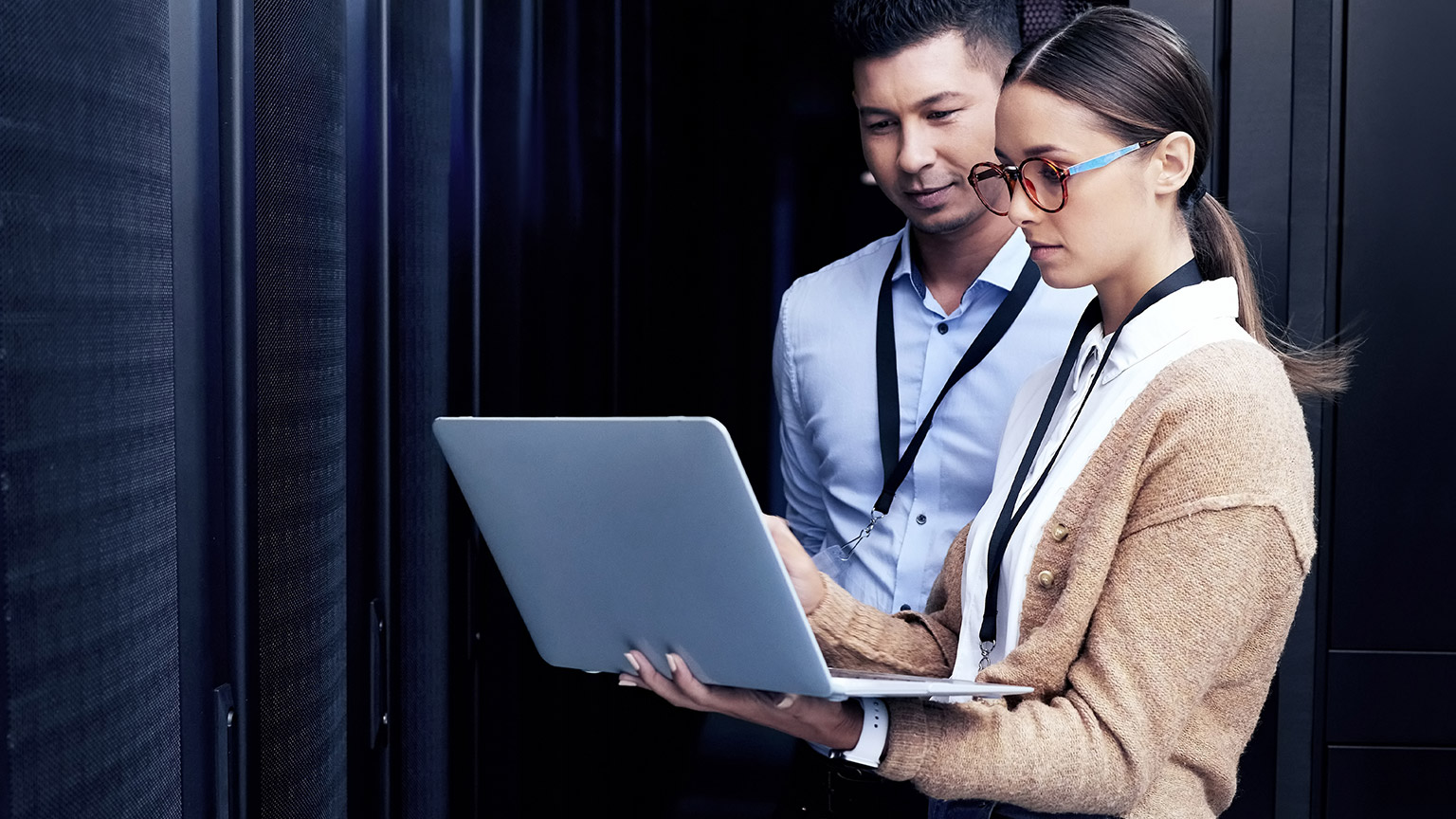 2 people in a server room