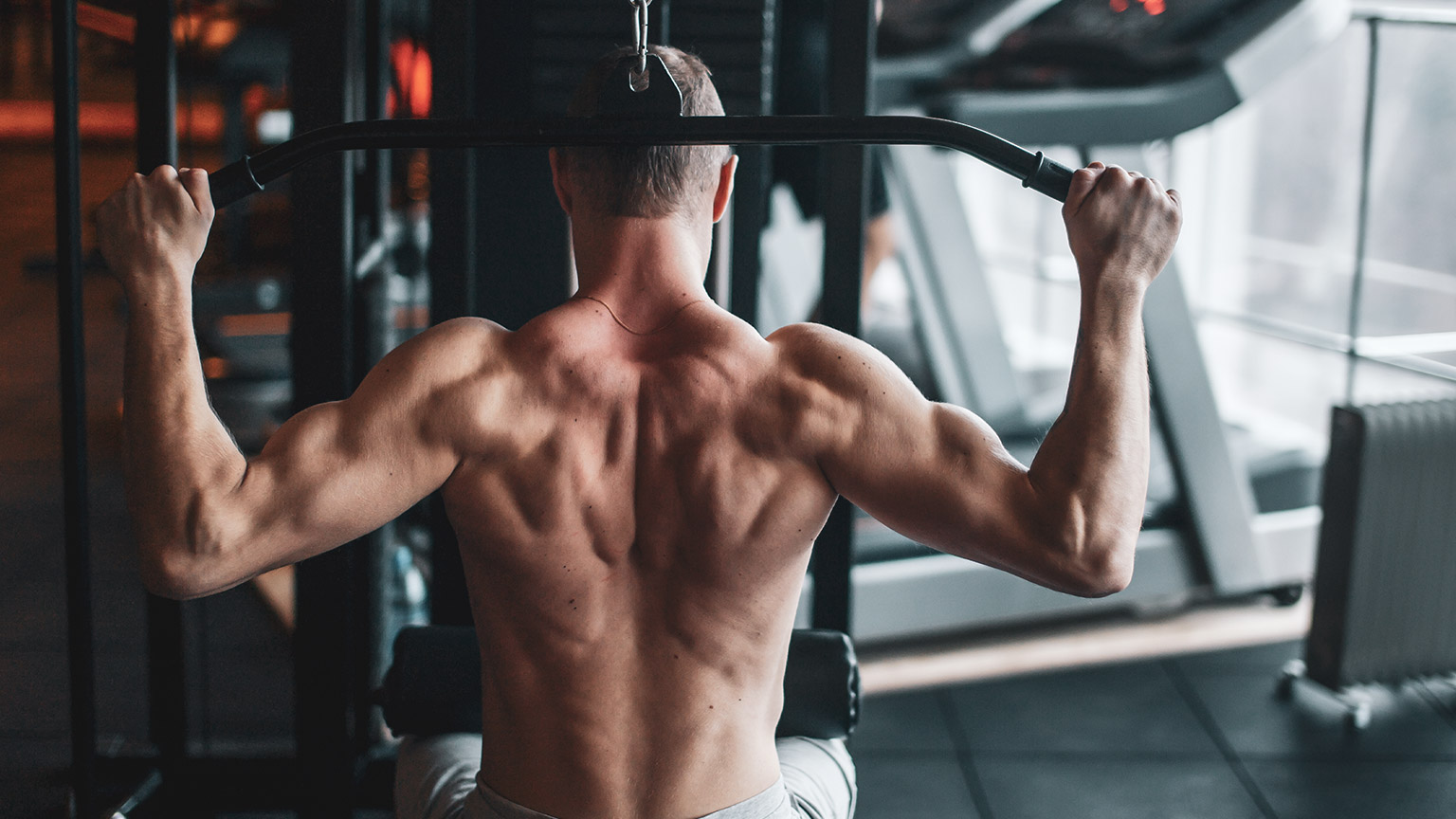 A person doing lat pulldowns