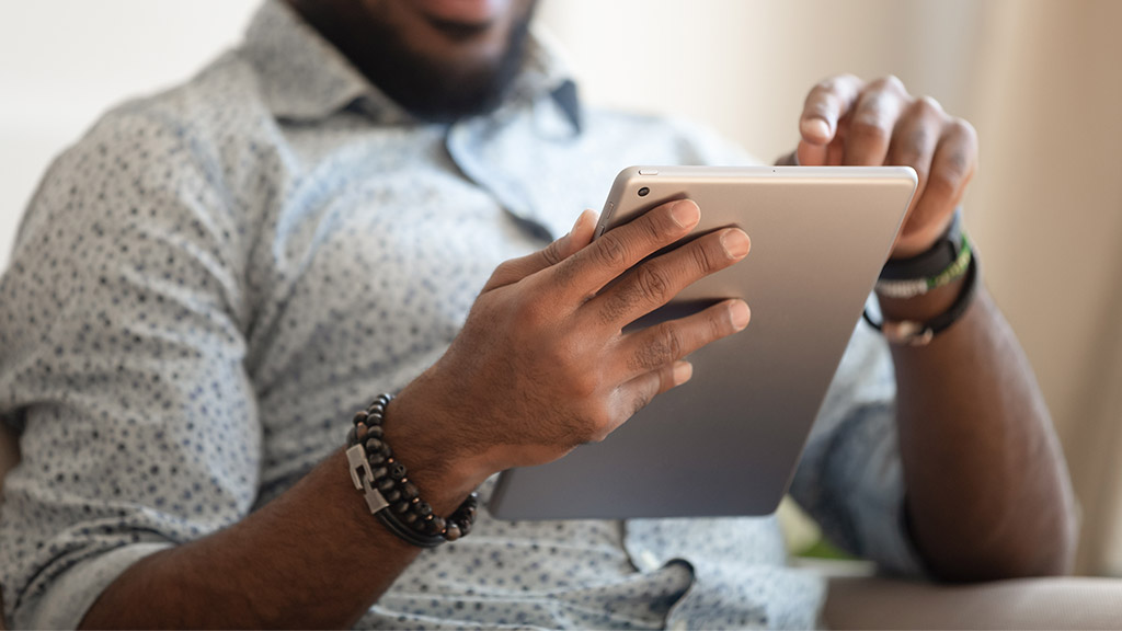 Close up focus african male hands holds tablet