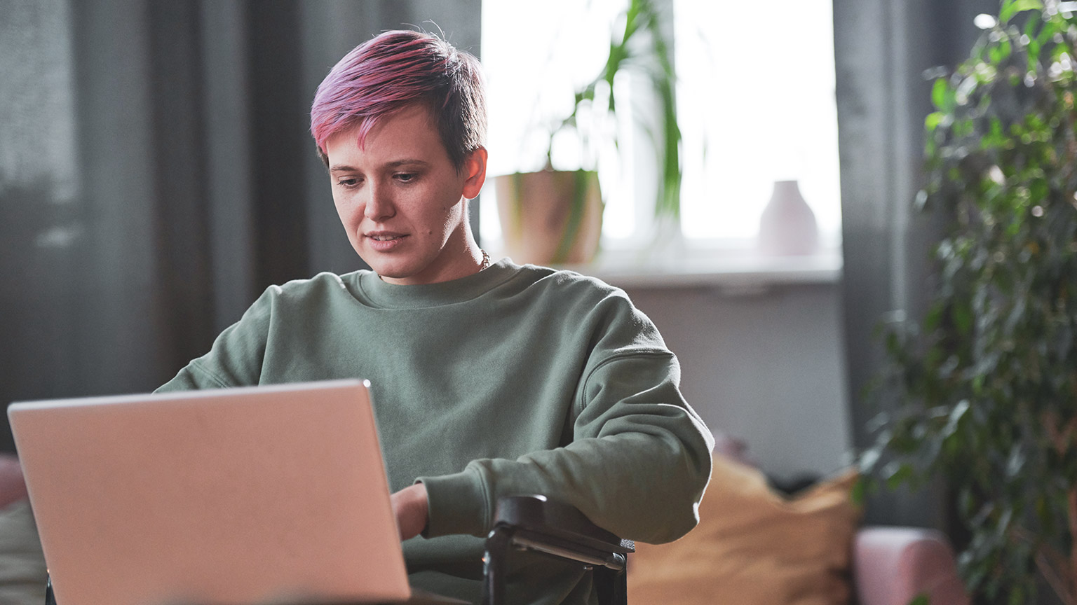 A person reading information on a laptop