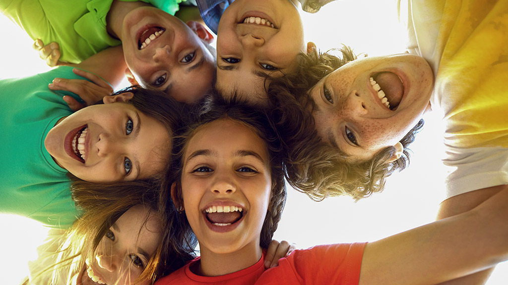 cheerful joyful cute little children playing together and having fun