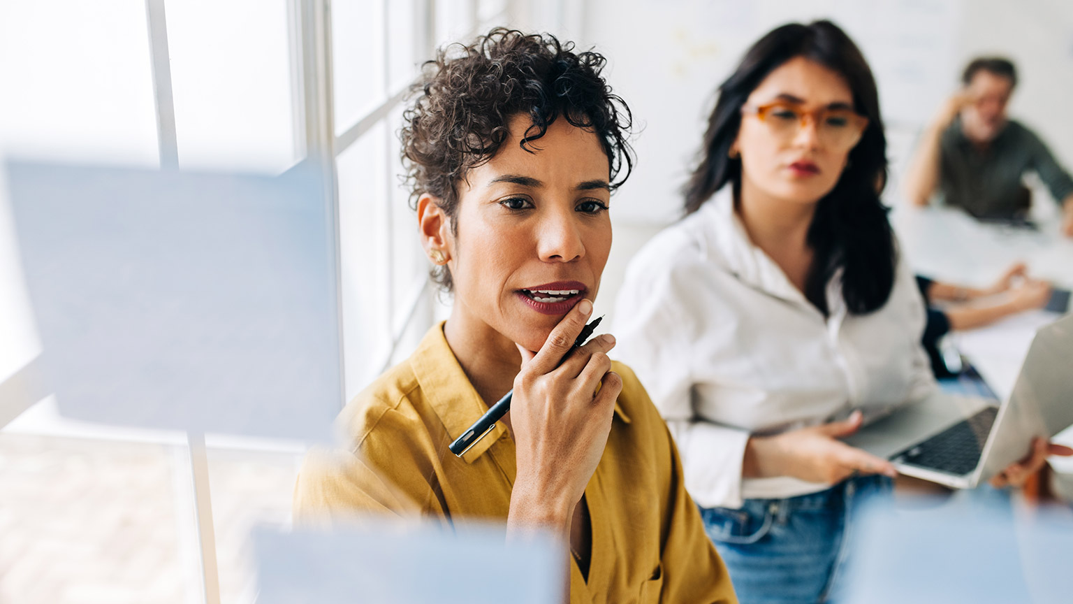 People discussing project management in an office