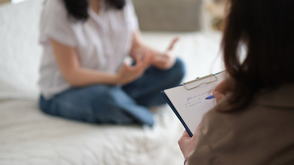 patient makes progress towards healing and recovery as she talks with her therapist about her struggles