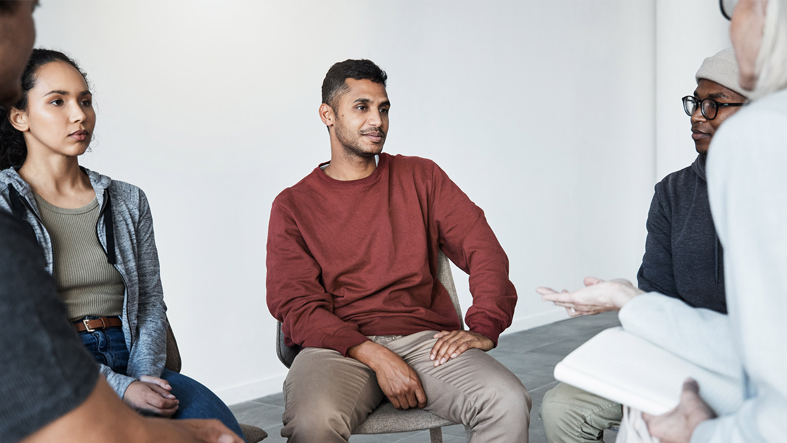 A counsellor talking to several people